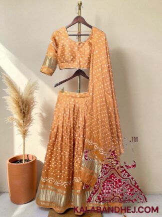 Ombre Peach Bandhani Chaniya Choli with Gold Zari Lagdi Patta Border